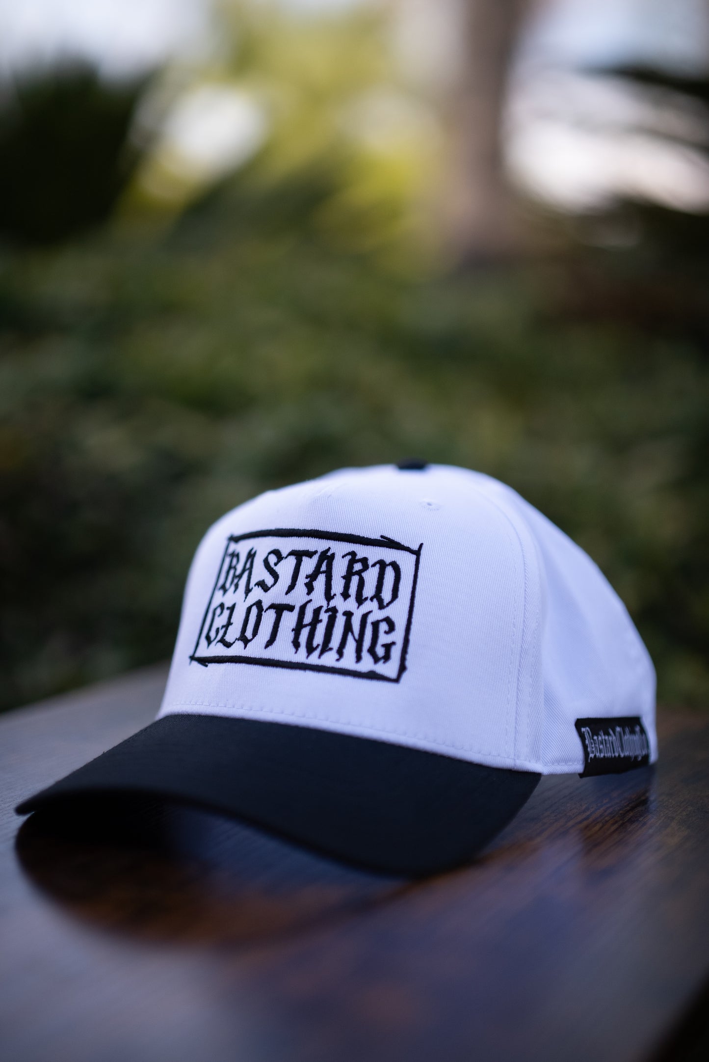 The Outcast White Curved Bill (White w/ Black Stitching)
